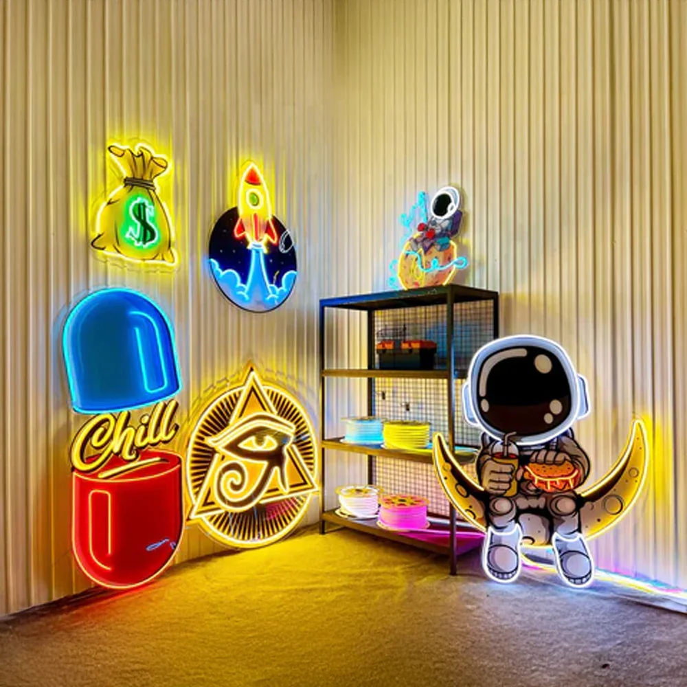 Colorful neon signs including astronaut on crescent moon, money bag, rocket, pill with chill text, and Eye of Horus on beige wall