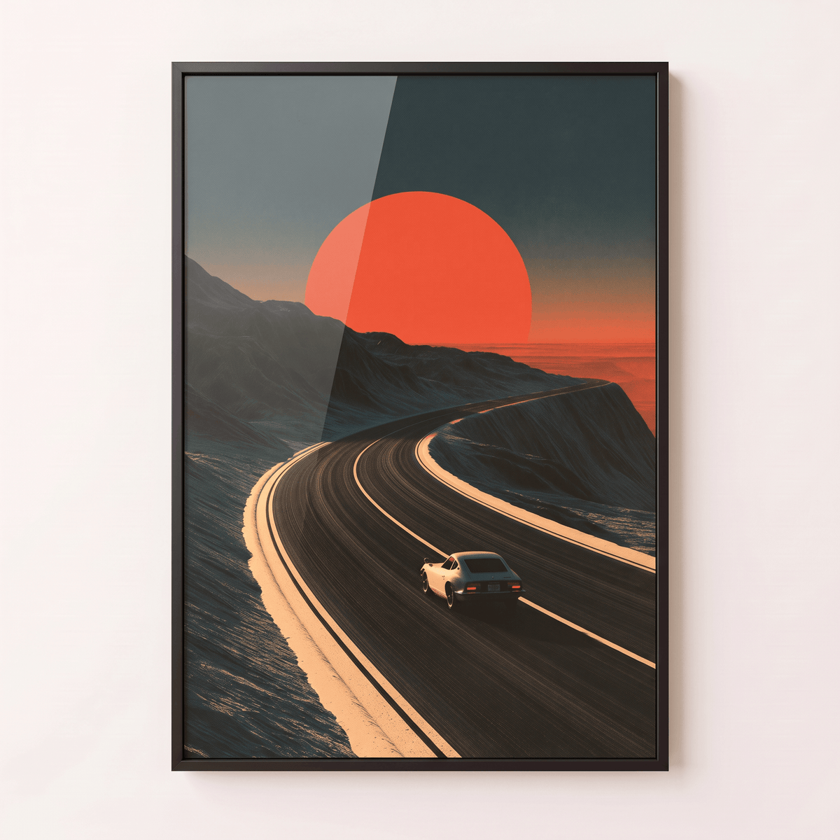 Black framed canvas print featuring a vintage sports car driving along a mountain road toward a massive glowing red sun.