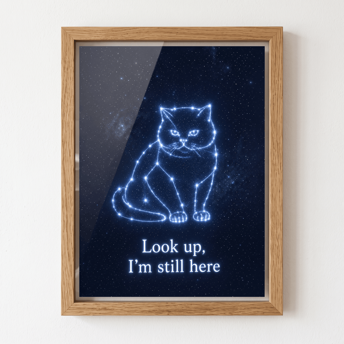 Oak framed canvas wall art featuring a glowing constellation cat memorial design with text Look up, I'm still here on starry night background.