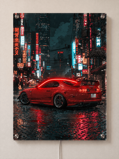 Red sports car night city acrylic wall art above desk