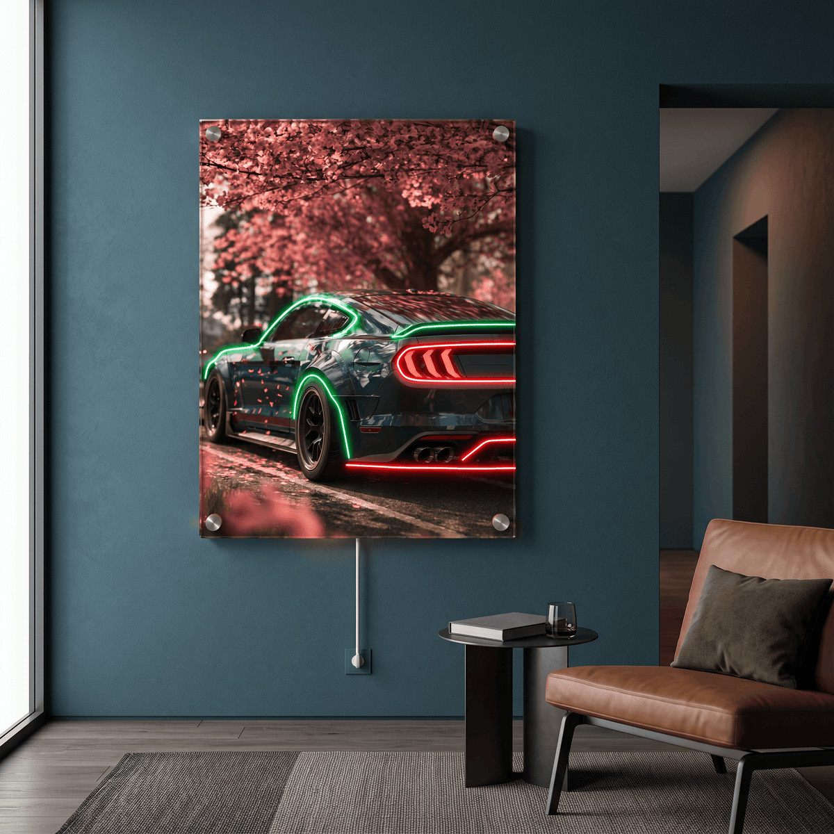 Glowing LED neon acrylic wall art featuring a sports car under pink cherry blossoms, mounted in a contemporary blue living room beside a leather armchair.