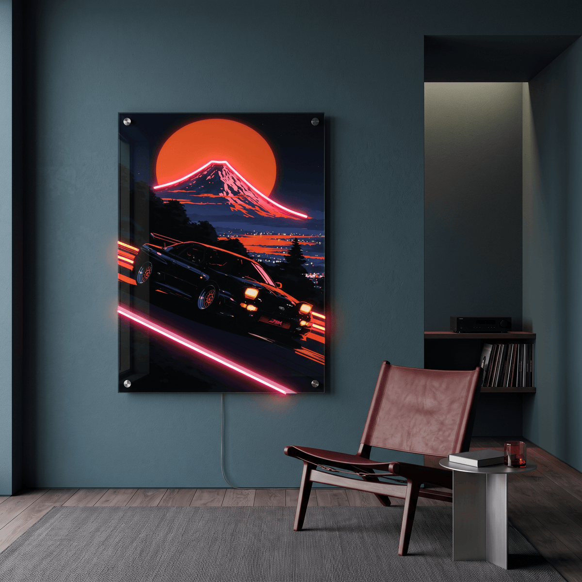 Glowing Japanese sports car and Mount Fuji LED neon acrylic wall art displayed in a modern lounge room with leather armchair.