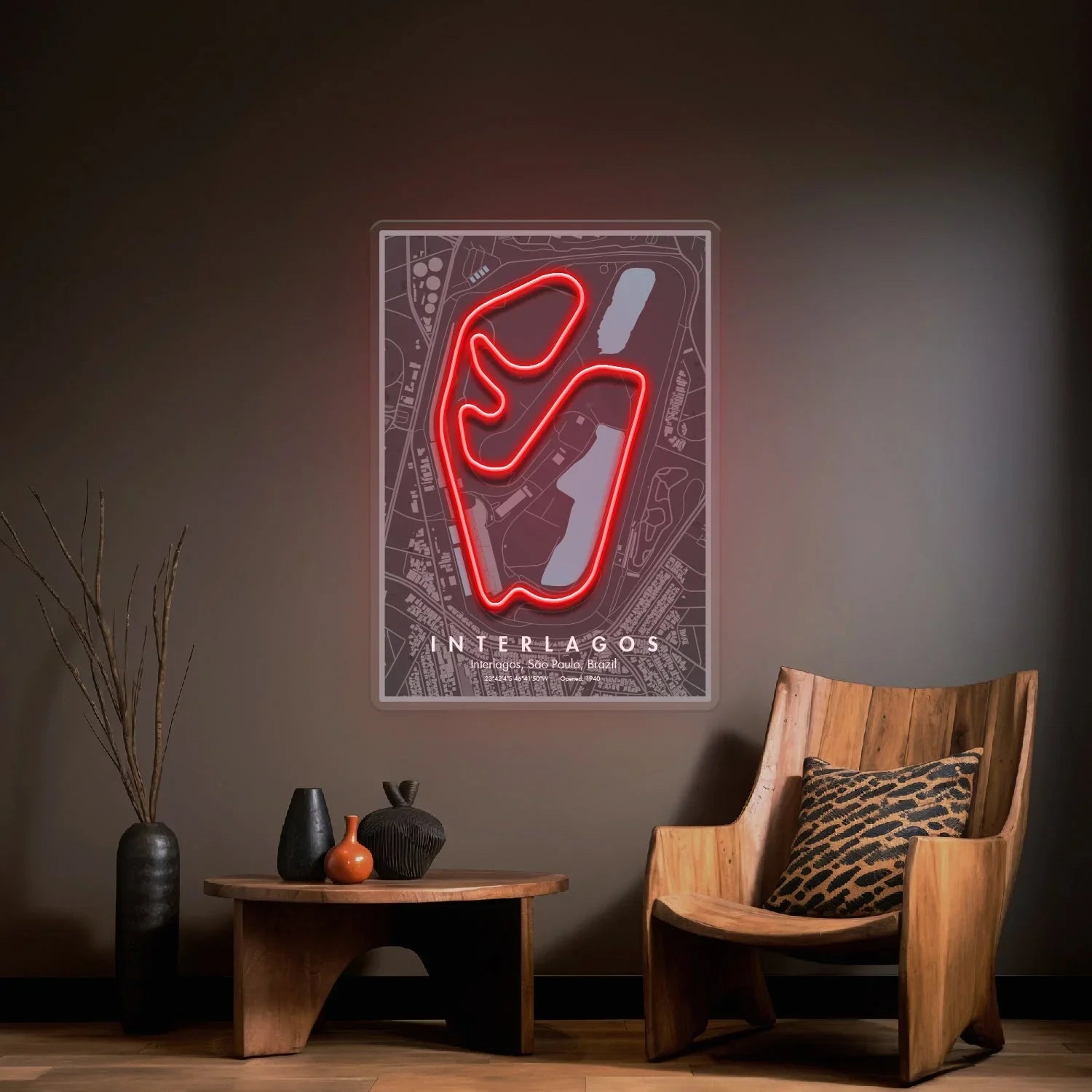 Modern living room with wooden chair, table, minimalist decor, and neon Interlagos race track wall art