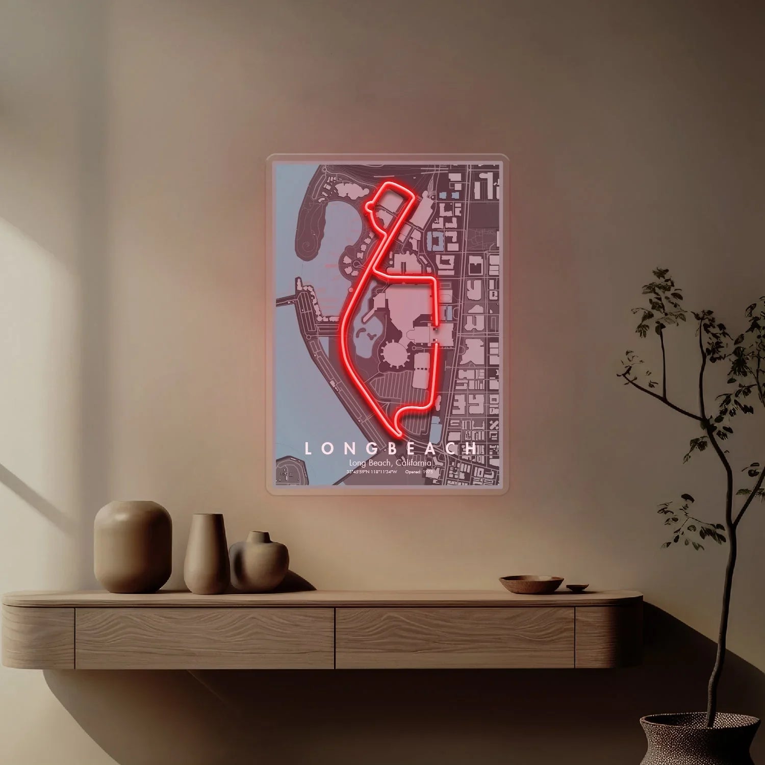 Modern wall art featuring illuminated neon red Long Beach Formula 1 racing circuit map above wooden shelf