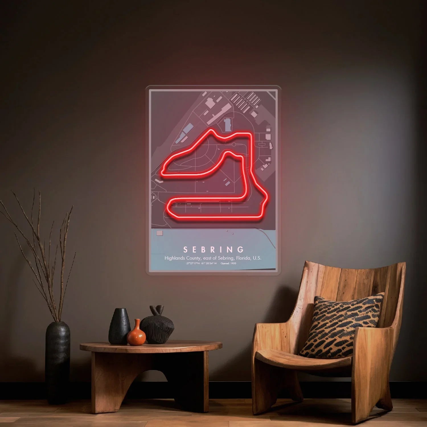 Modern interior with wood chair, table, decorative vases, and neon Sebring racetrack map on wall