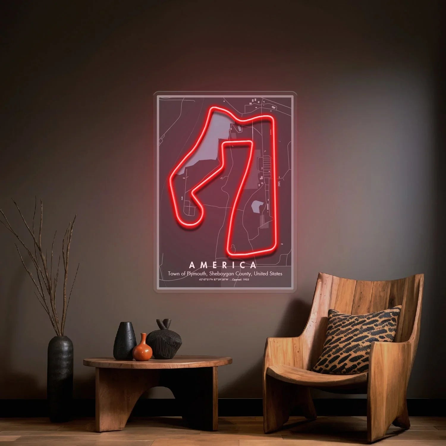 Modern living room with wooden chair, table, vases, and neon red light USA Formula 1 circuit map wall art